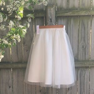 white skirt with mesh overlay